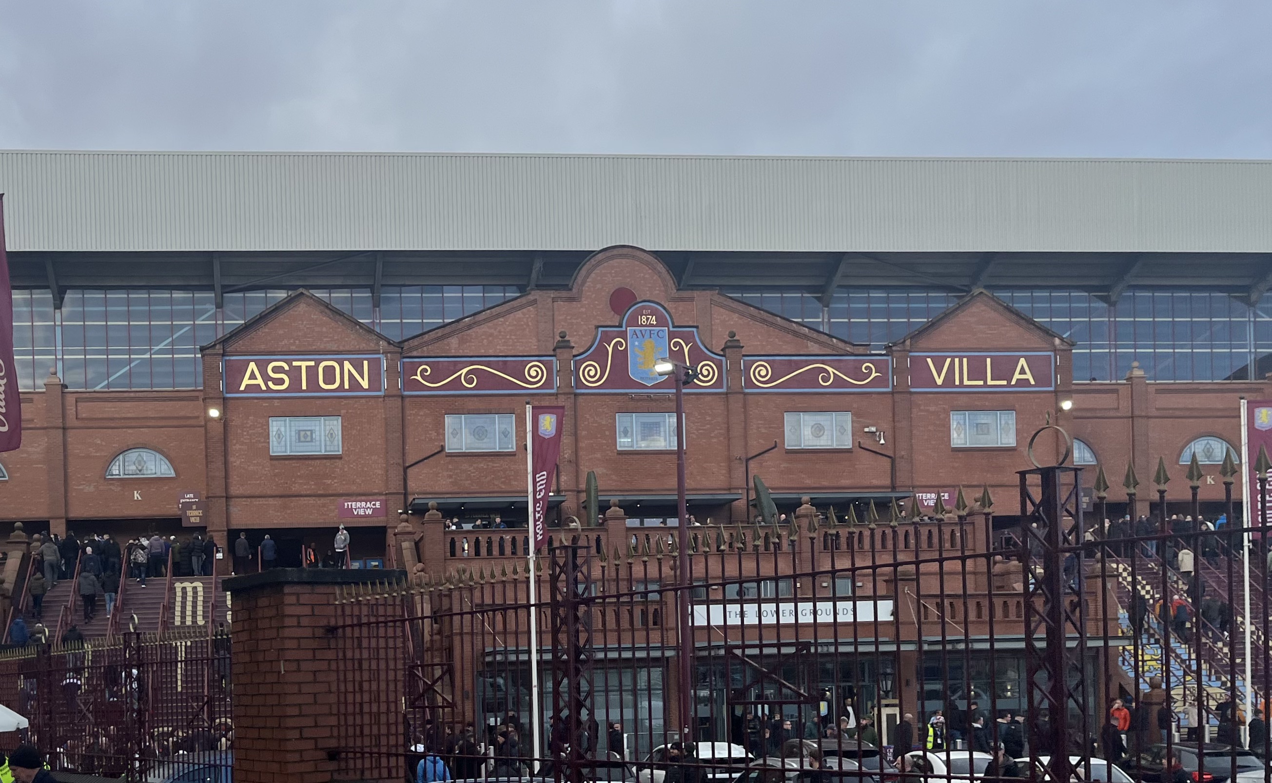 Villa Park exterior and Aston Villa supporters on matchday in Birmingham